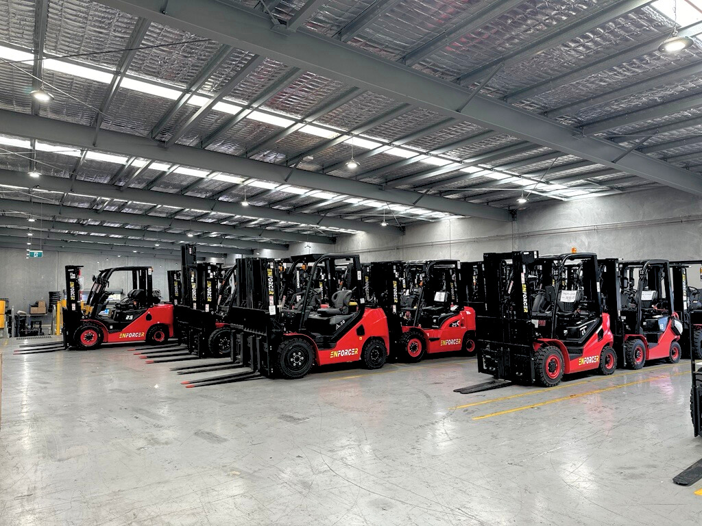 Fleet of Enforcer Forklifts in Warehouse lined up 