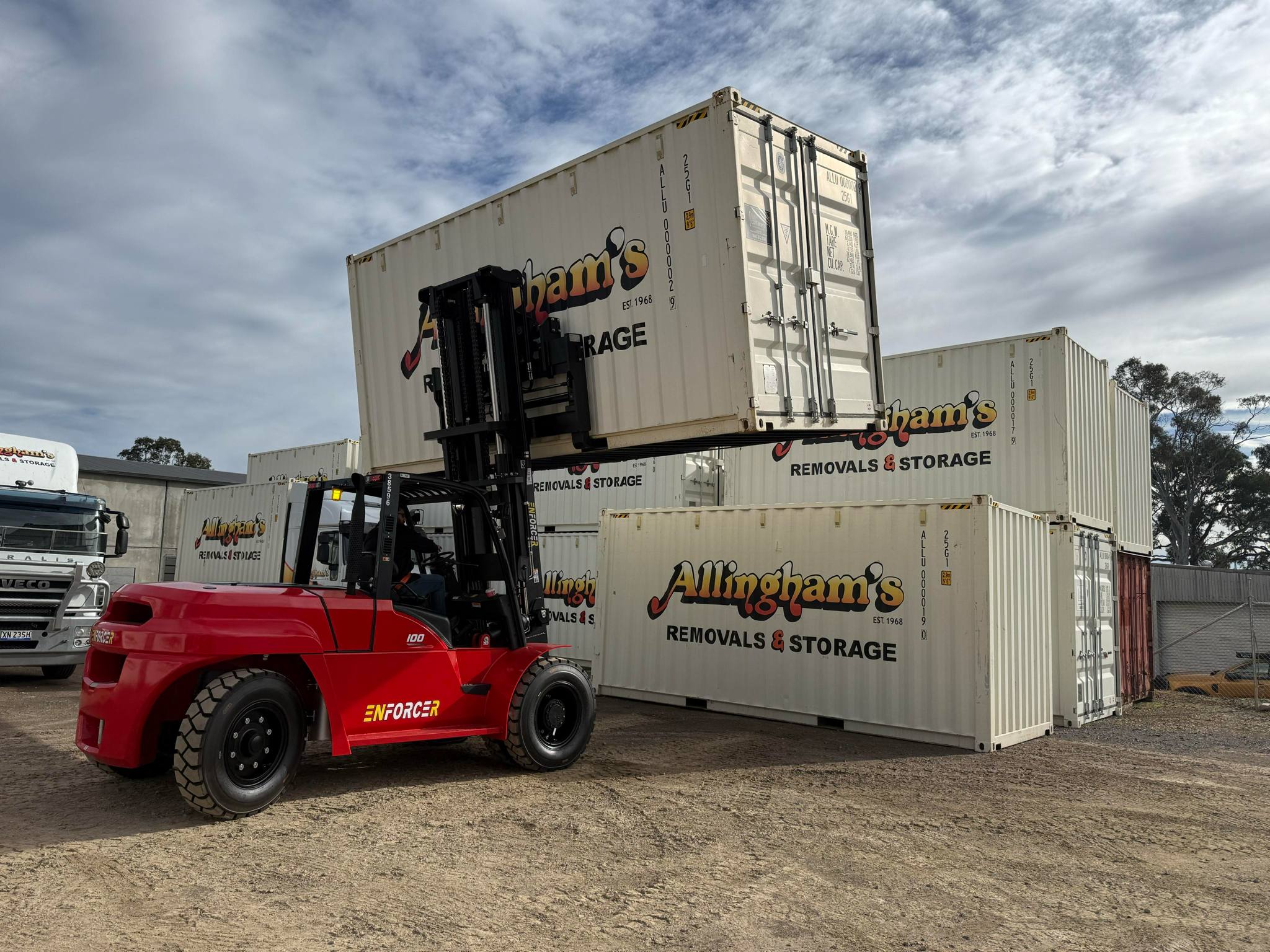 Enforcer Forklift lifting Allingham's Removals shipping container