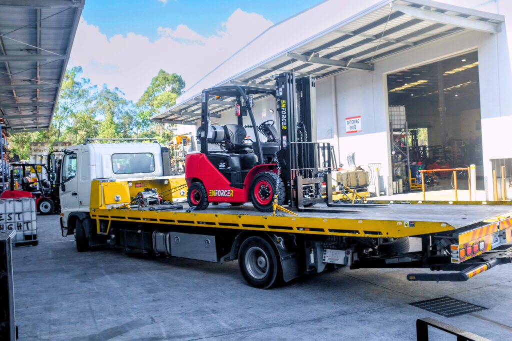 Enforcer forklift on tow truck